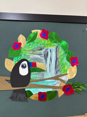 Toucan with a waterfall in the background