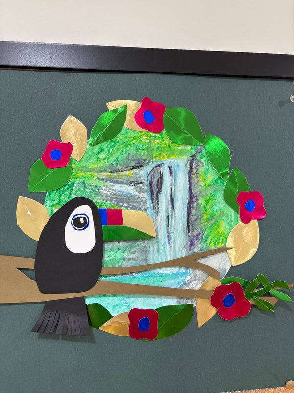 Toucan with a waterfall in the background